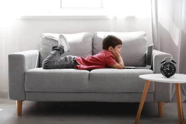 Little Boy Watching Cartoons Laptop Sofa Living Room — Stock Photo, Image