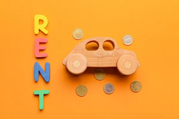 Wooden Car Coins Word Rent Orange Background — Stock Photo, Image