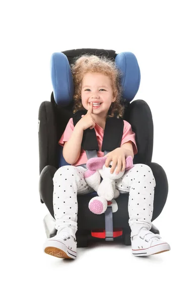 Cute Little Girl Toy Buckled Car Safety Seat White Background — Stock Photo, Image