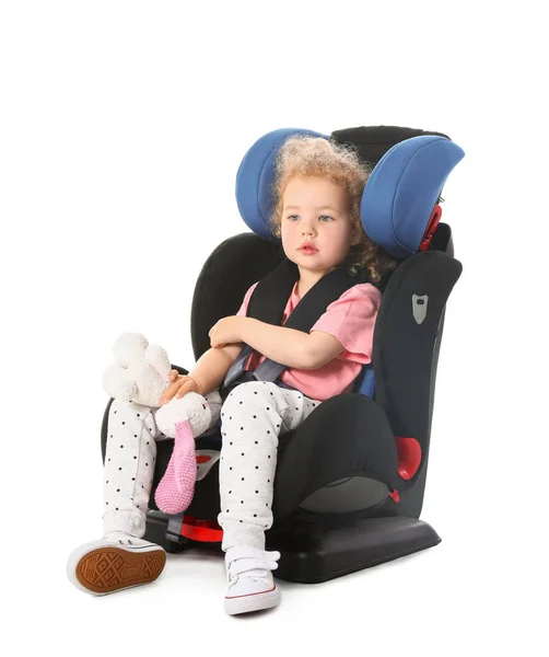 Cute Little Girl Toy Buckled Car Safety Seat White Background — Stock Photo, Image