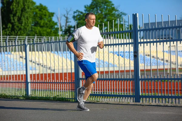 Sporty Mature Man Running Stadium — Stock Photo, Image