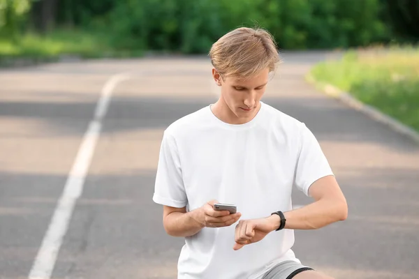 Sporty Male Runner Checking Pulse Outdoors — Stock Photo, Image