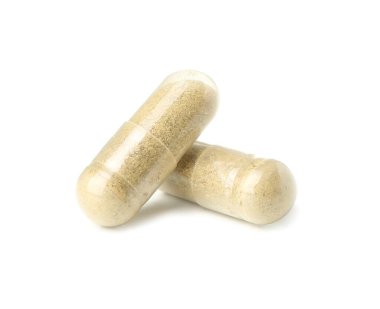 Beyaz arka planda K vitamini hapları