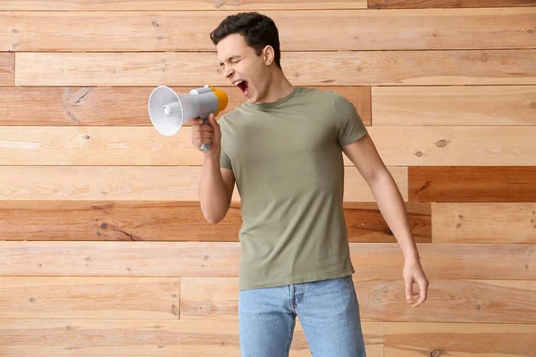 Protesting Young Man Megaphone Wooden Background — Stock Photo, Image