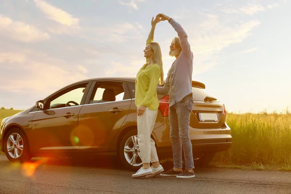 Happy Mature Couple Dancing Car Countryside — Stock Photo, Image