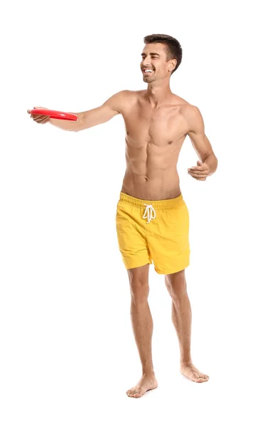 Junger Mann Wirft Frisbee Auf Weißem Hintergrund — Stockfoto