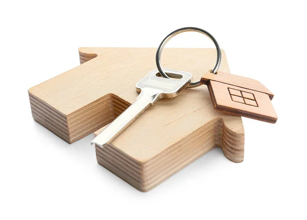 带钥匙链的钥匙和白色背景的房子图形 — 图库照片