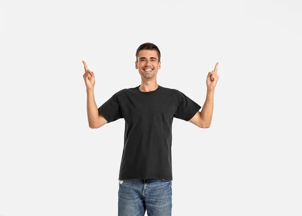 Handsome Young Man Stylish Shirt Pointing Something Light Background — Stock Photo, Image