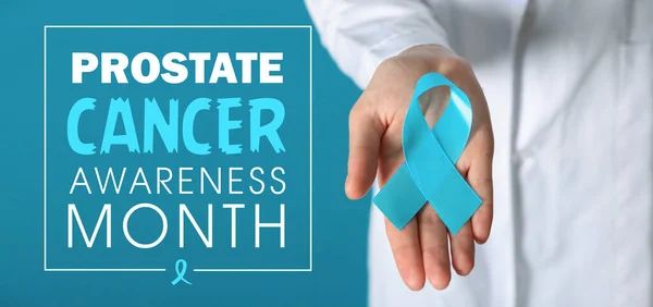 stock image Doctor with blue ribbon and text PROSTATE CANCER AWARENESS MONTH on color background 