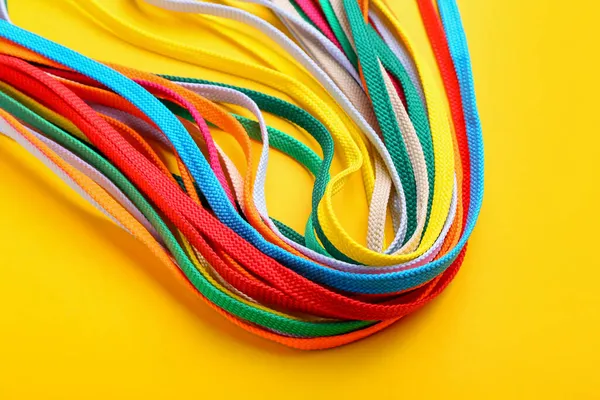 Many Different Shoe Laces Yellow Background Closeup — Stock Photo, Image