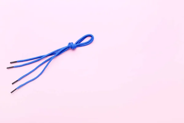 Blue Shoe Laces Tied Knot Pink Background — Stock Photo, Image