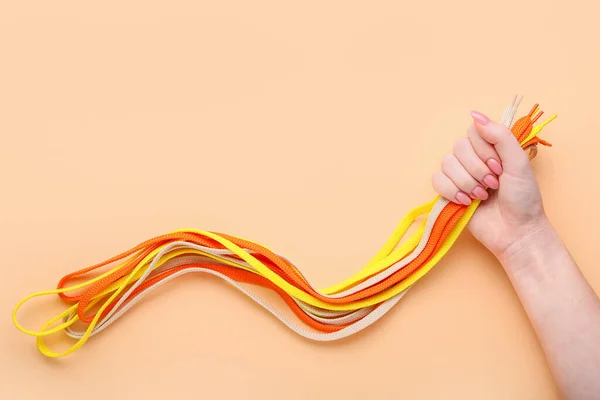 Woman Holding Many Different Shoe Laces Color Background Closeup — Stock Photo, Image