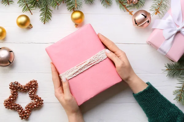 Woman Holding Christmas Gift Light Wooden Background Closeup — Stock Photo, Image