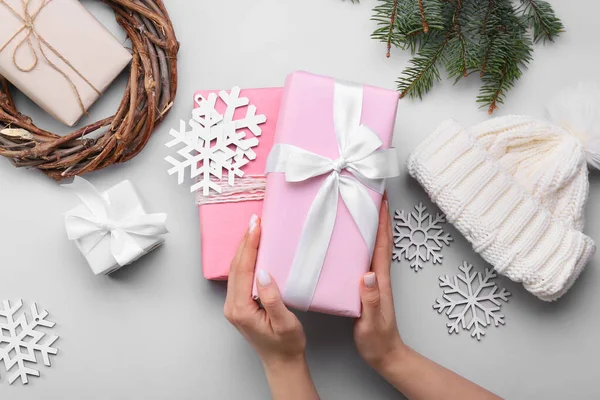 Female Hands Christmas Gifts Decorations Warm Hat Lilac Background Closeup — Stock Photo, Image