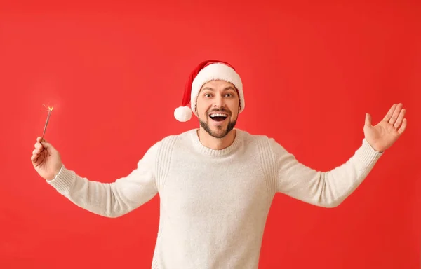 Handsome Man Christmas Sparkler Red Background — Stock Photo, Image