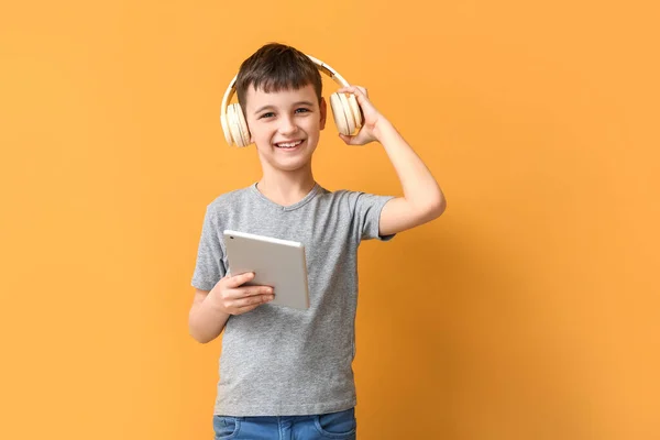 Little Boy Tablet Computer Headphones Color Background — Stock Photo, Image