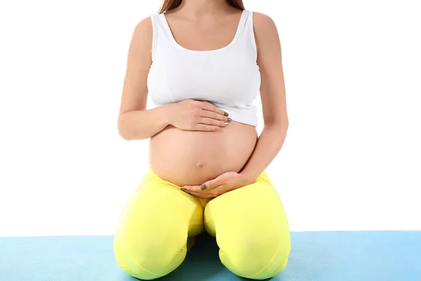 若いです妊娠中の女性は白い背景でヨガをしています クローズアップ — ストック写真