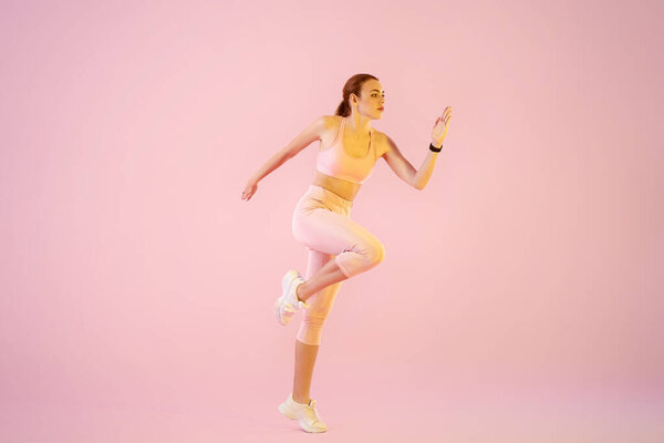 Sporty running woman on color background