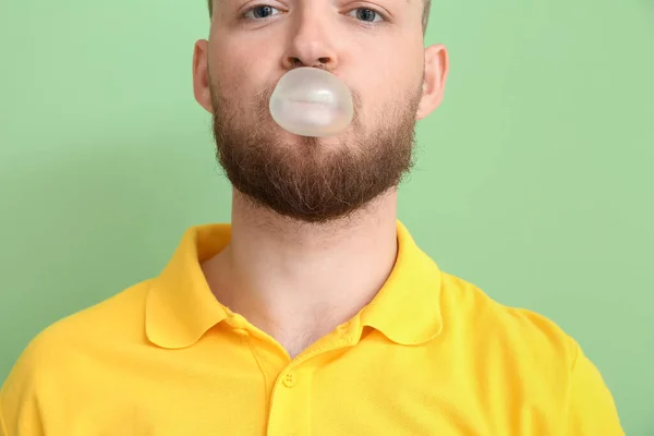 Young Man Chewing Gum Color Background — Stock Photo, Image