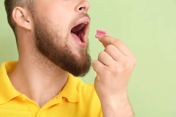 Young Man Chewing Gum Color Background Closeup — Stock Photo, Image