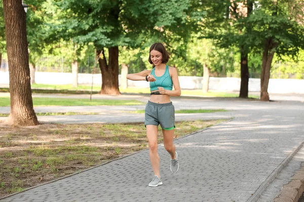 Sporty Female Runner Checking Pulse Outdoors — Stock Photo, Image