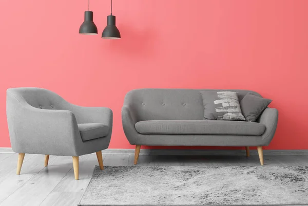 Grey Armchair Sofa Black Lamps Hanging Pink Wall — Stock Photo, Image