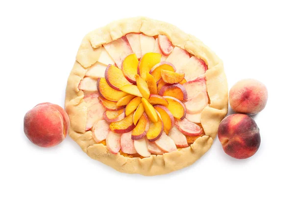 Raw peach galette on white background