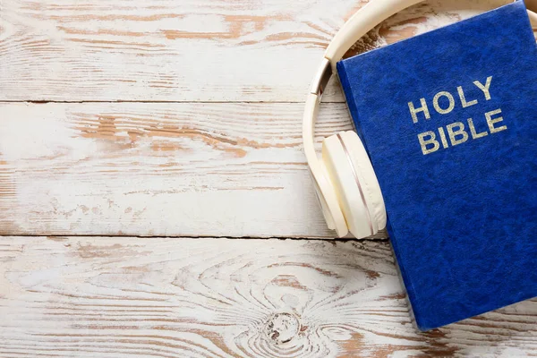Holy Bible Modern Headphones Light Wooden Background — Stock Photo, Image