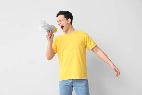 Protesting Young Man Megaphone Light Background — Stock Photo, Image