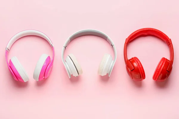 Different Modern Headphones Pink Background — Stock Photo, Image