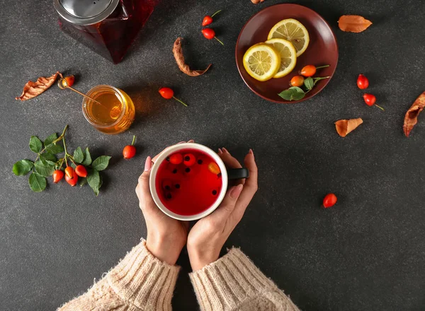 Woman Holding Cup Tasty Rose Hip Tea Black Background — Stock Photo, Image