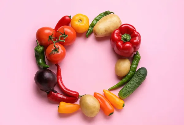 Frame made of different vegetables on color background. Vegan Day