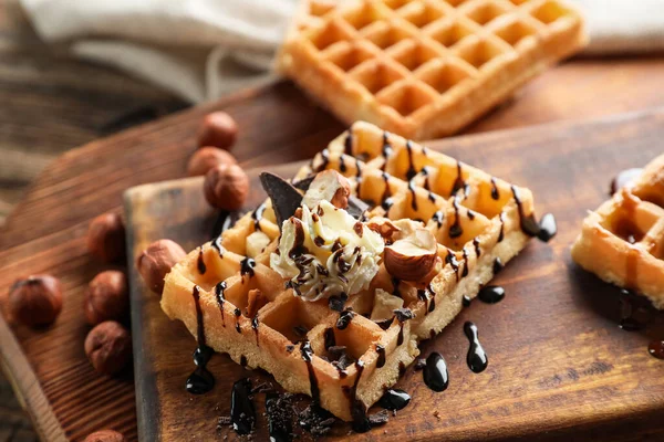 Board Tasty Belgian Waffles Cream Hazelnut Wooden Background — Stock Photo, Image