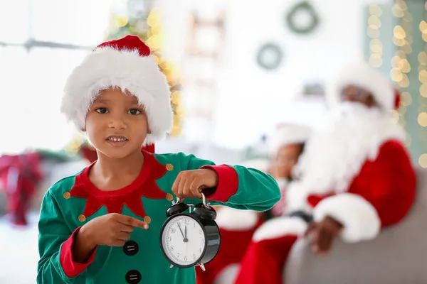 Little African American Boy Dressed Elf Pointing Alarm Clock Home — Stock Photo, Image