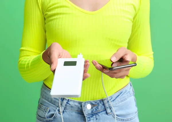 Young Woman Phone Power Bank Color Background — Stock Photo, Image