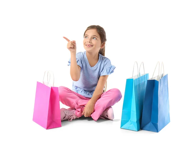 Little Girl Black Friday Shopping Bags Pointing Something White Background — Stock Photo, Image