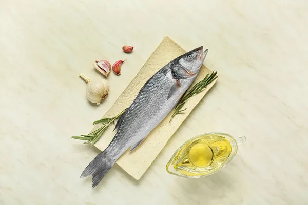 Board Fresh Uncooked Sea Bass Fish White Marble Background — Stock Photo, Image