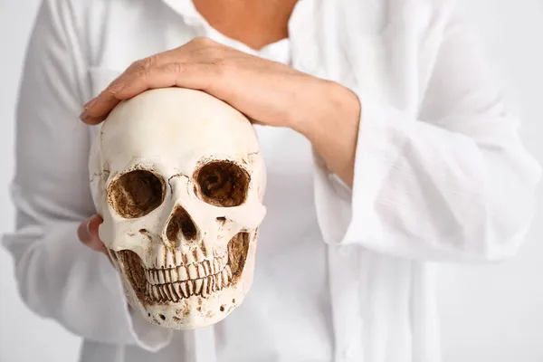 Woman Holding Human Skull White Background — Stock Photo, Image