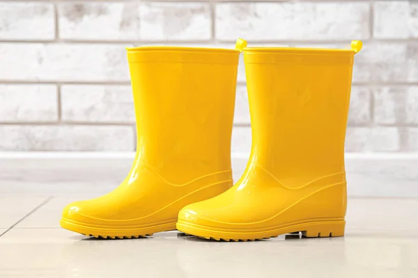 Pair Rubber Rain Boots Floor Brick Wall — Stock Photo, Image