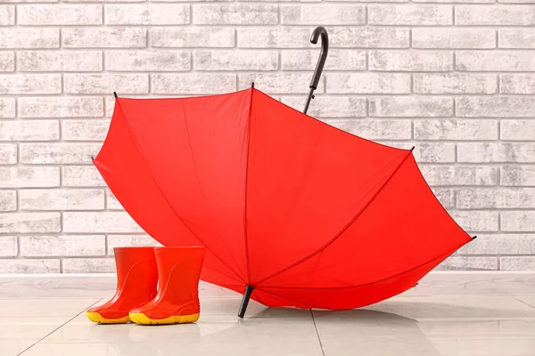 Pair Rubber Rain Boots Umbrella Brick Wall — Stock Photo, Image