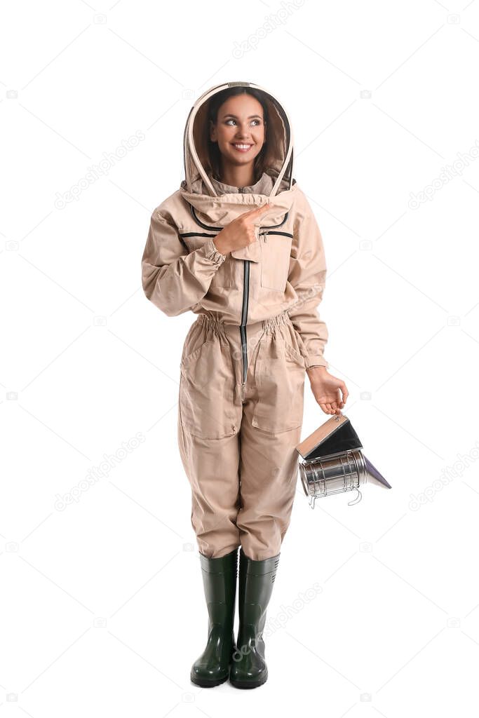 Female beekeeper pointing at something on white background