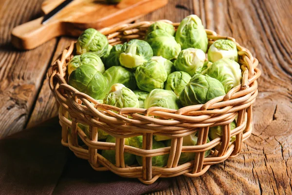 Wicker Basket Raw Brussels Cabbage Wooden Background — Stock Photo, Image