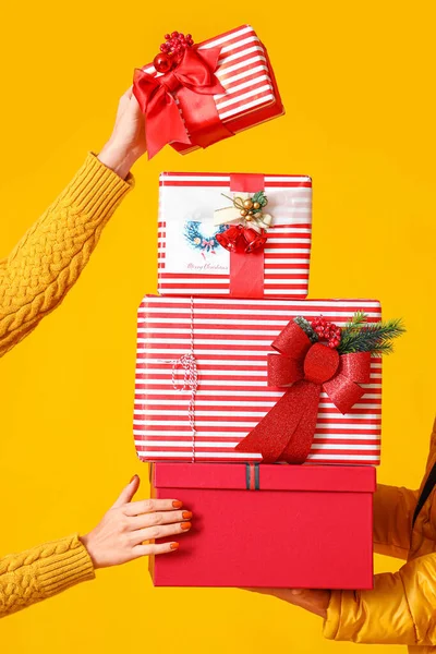 Woman Man Holding Christmas Gift Boxes Yellow Background — Stock Photo, Image