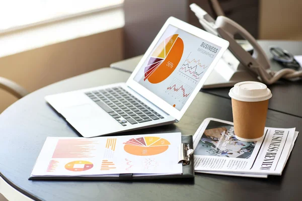 Laptop Charts Newspaper Cup Coffee Table Office — Stock Photo, Image