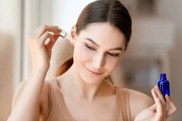 Beautiful Woman Applying Natural Essential Oil Face — Stock Photo, Image