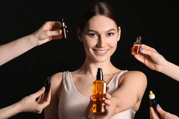 Happy Woman Female Hands Holding Bottles Essential Oil Dark Background — Stock Photo, Image