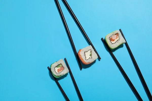 Chopsticks Different Sushi Rolls Color Background — Stock Photo, Image