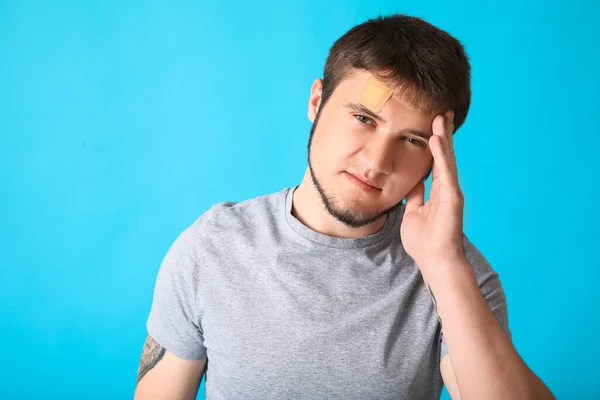 Man Medical Patch His Forehead Color Background — Stock Photo, Image