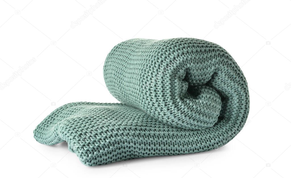 Rolled knitted blanket on white background