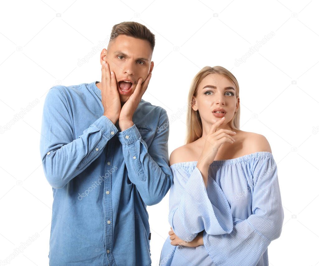 Gossiping young couple on white background